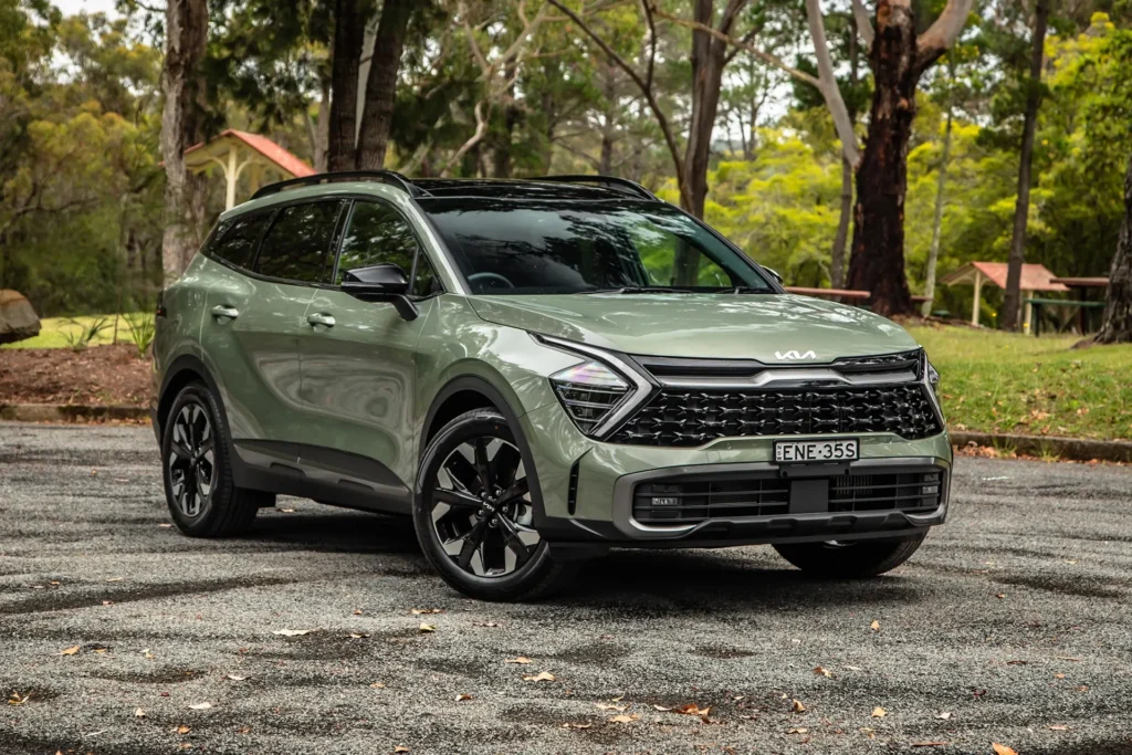 2026 Kia Sportage Hybrid SUV front three quarter view parked in an Australian park