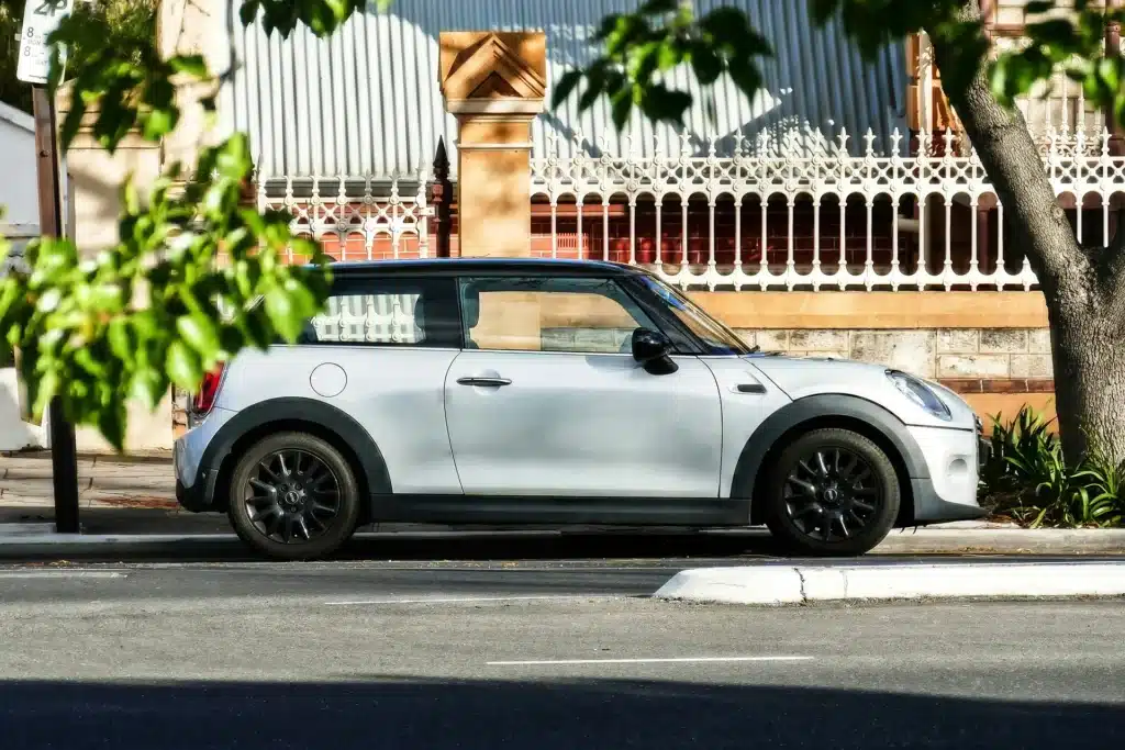 parked small car showing how vehicles lose value over time through depreciation