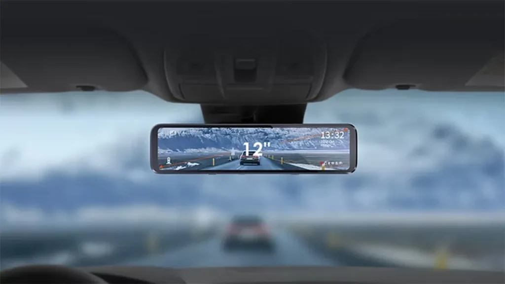 Wide digital rearview mirror display showing enhanced rear visibility with on-screen driving data