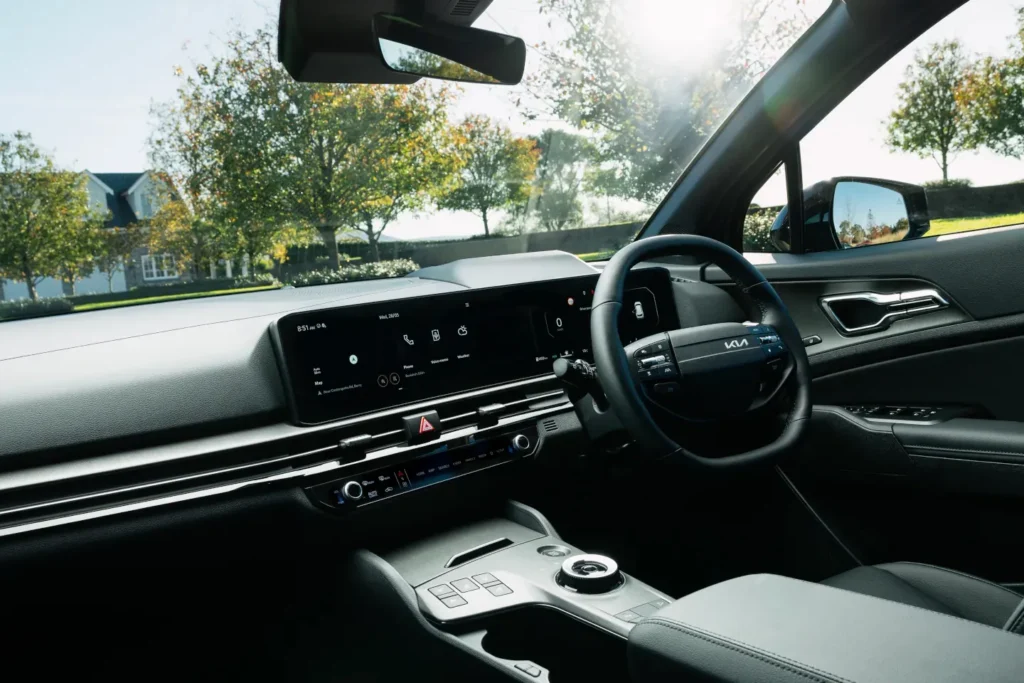 Kia Sportage interior dashboard and steering wheel with digital display