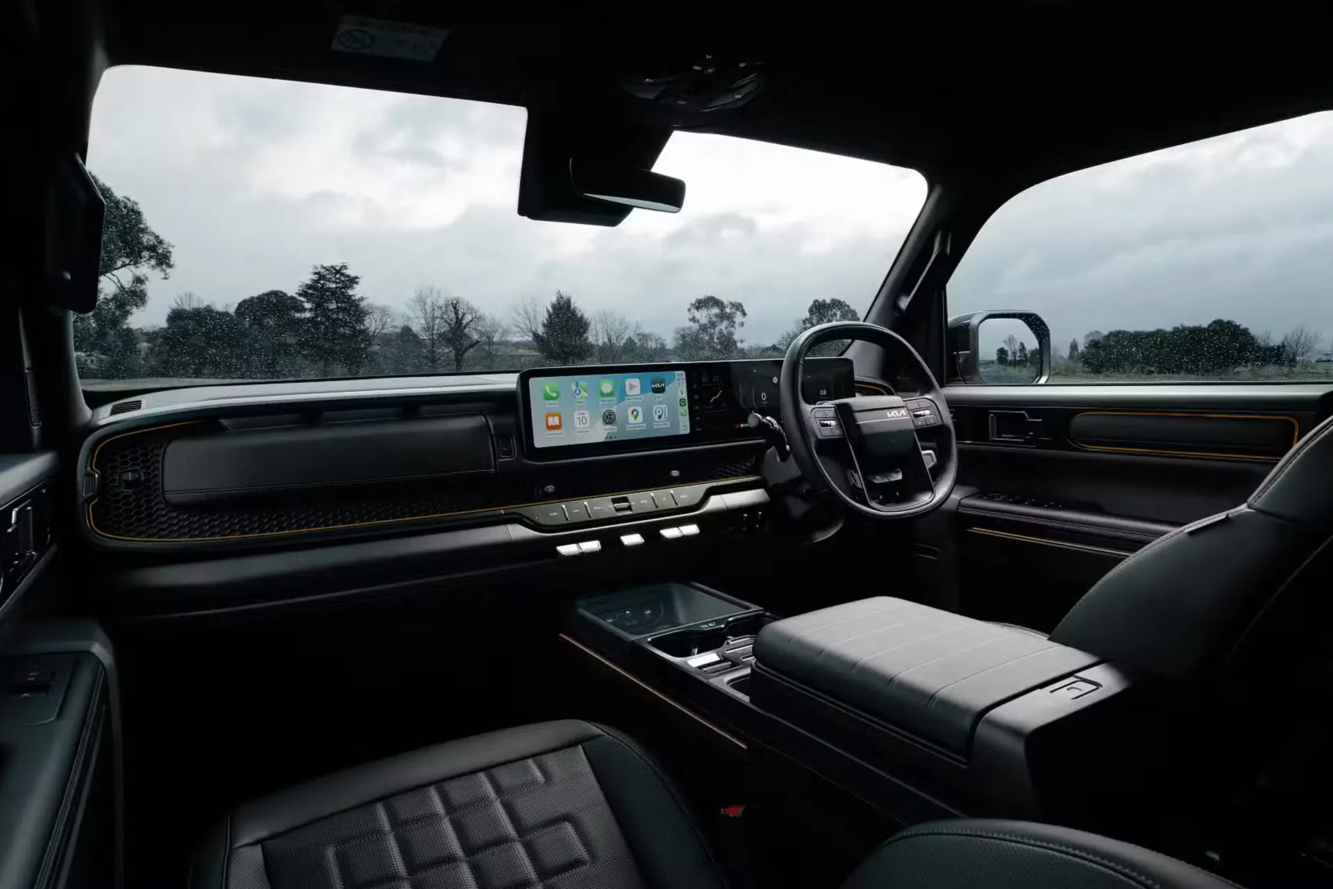 Interior dashboard of the Kia Tasman ute showing widescreen infotainment display and digital driver cockpit.