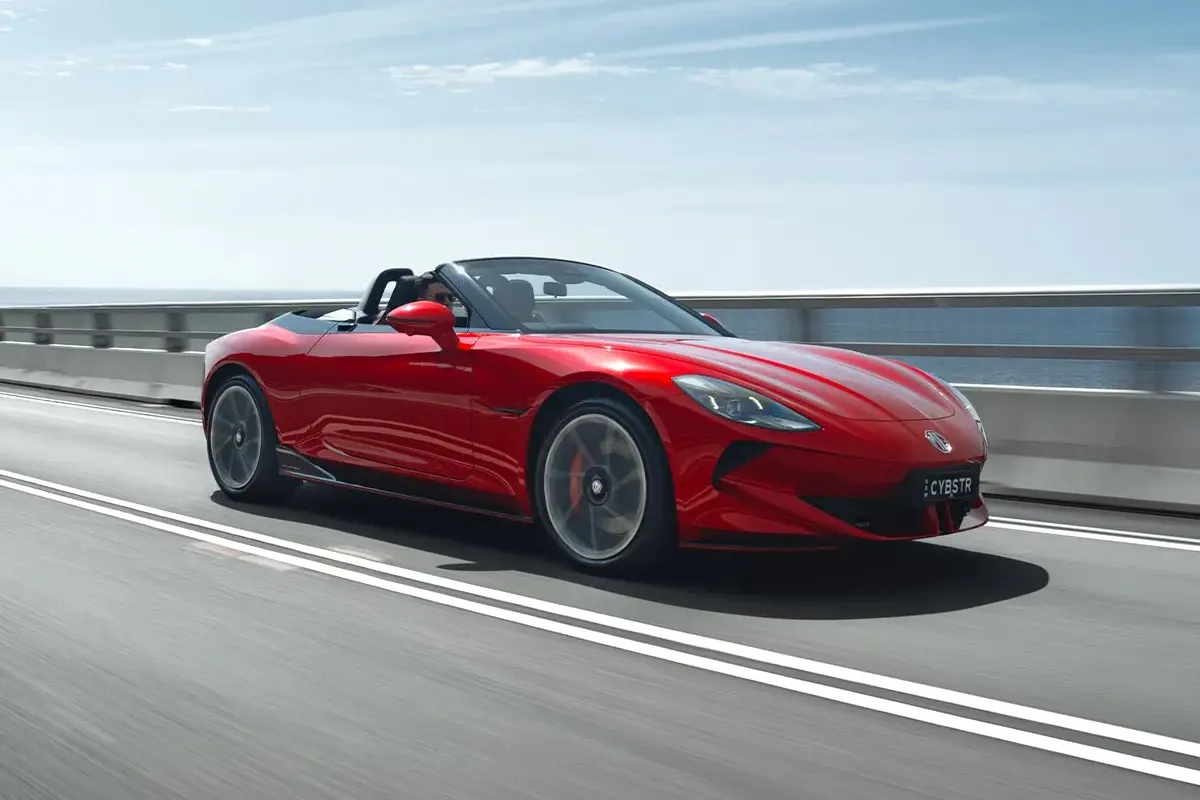 MG Cyberster GT electric roadster driving at speed showing aggressive front design