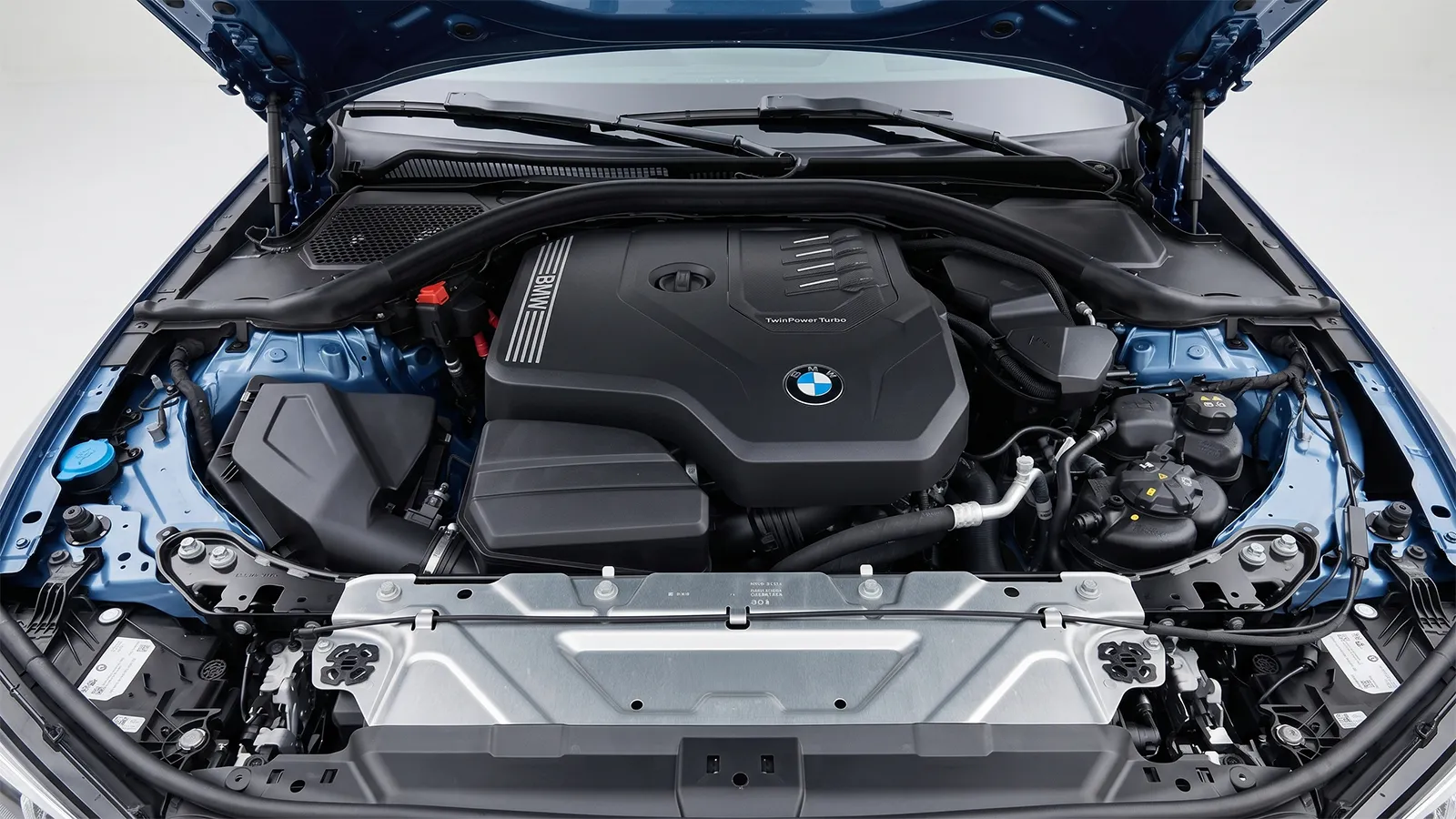 Engine bay of the 2026 BMW 330i showing the 2.0-litre TwinPower Turbo B48 four-cylinder petrol engine under its plastic cover
