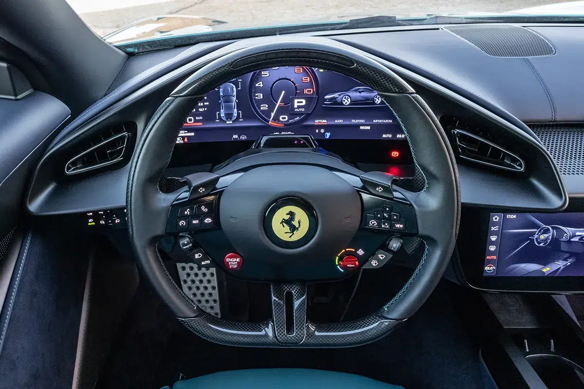 Ferrari steering wheel with retrofitted physical buttons replacing capacitive haptic touch controls