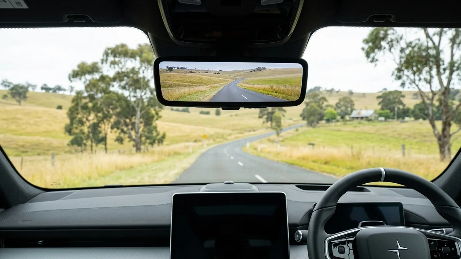 Polestar 4 digital rear-view mirror displaying a high-definition feed of the road behind in place of a traditional rear window