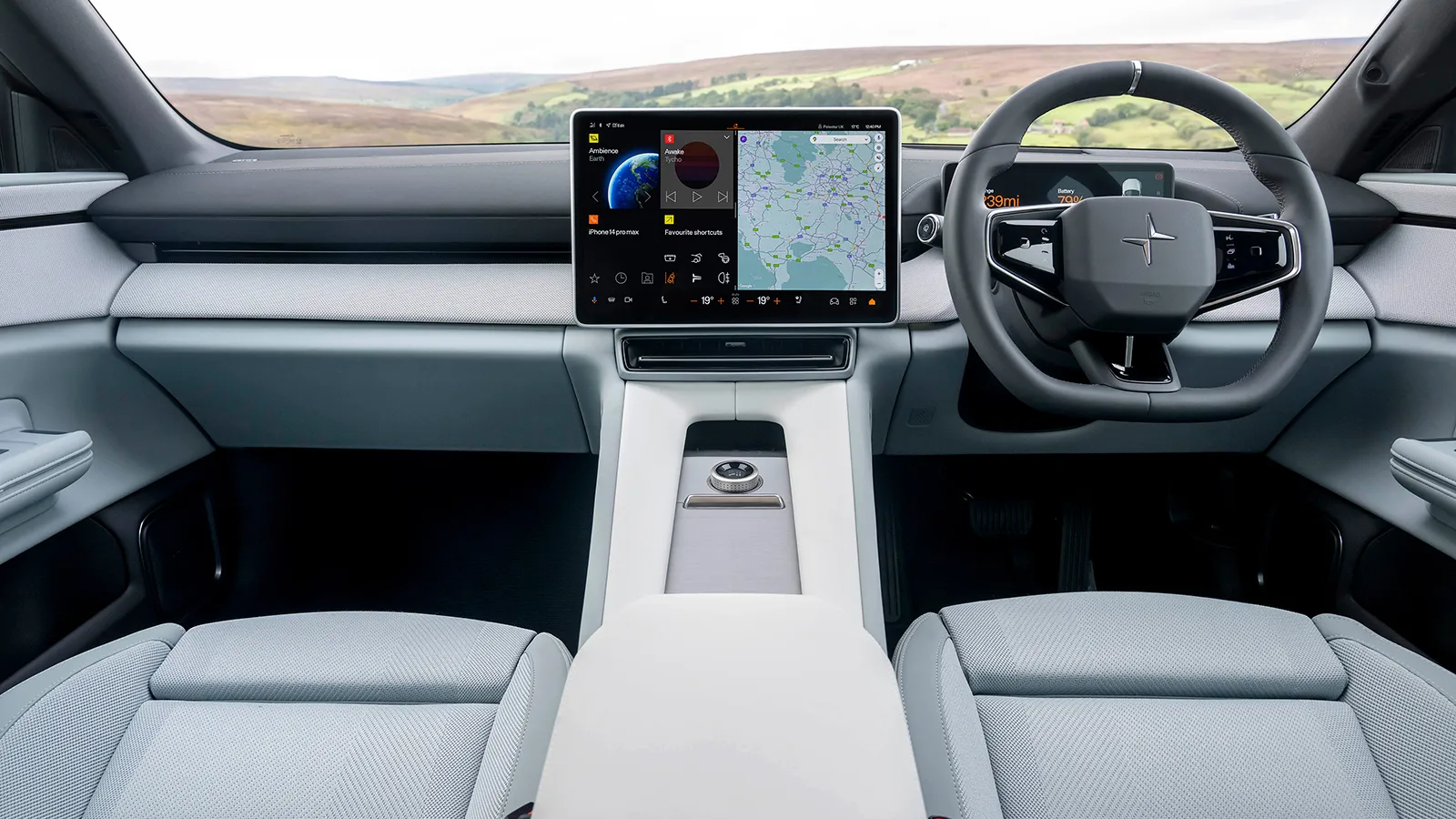 Polestar 4 interior dashboard featuring the 15.4-inch landscape touchscreen, minimalist steering wheel and sustainable upholstery