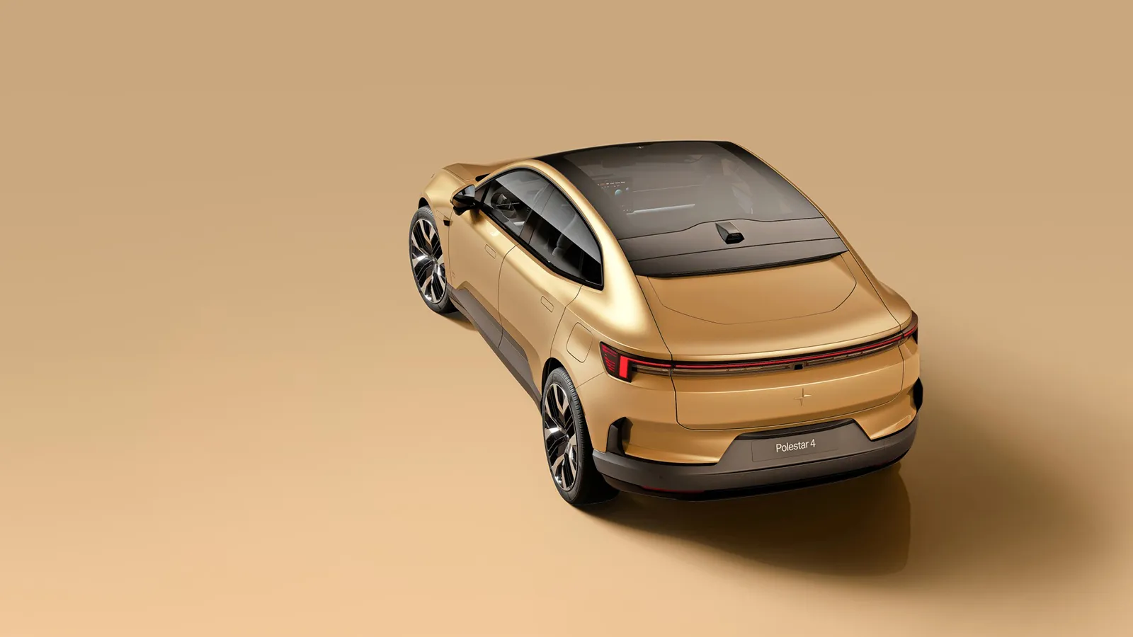 Polestar 4 rear three-quarter elevated angle highlighting the uninterrupted coupe-SUV roofline and electrochromic glass roof