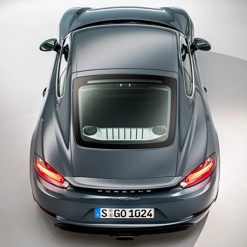 Overhead rear view of the 2026 Porsche 718 Cayman showing the rear engine cover and tail lights