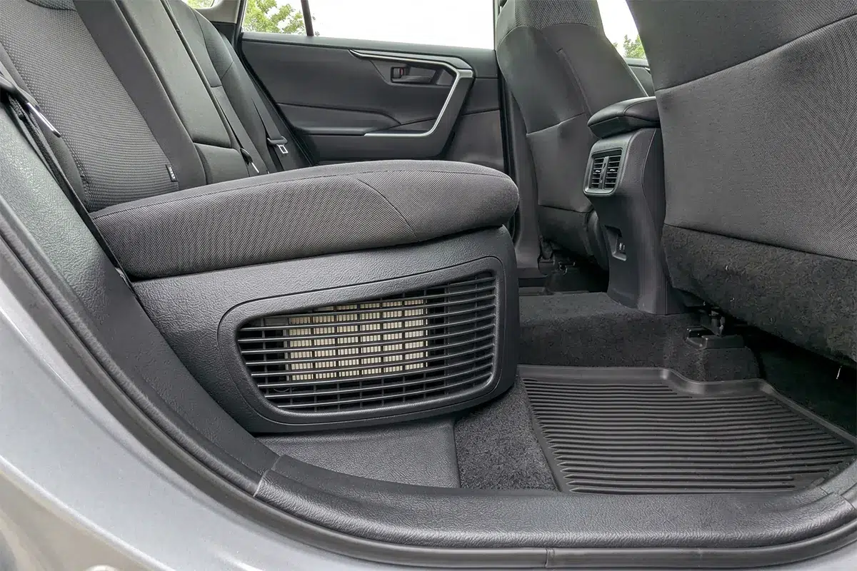 Hybrid battery cooling intake vent located at the base of the rear seat in a Toyota RAV4 Hybrid