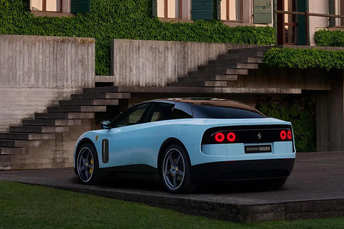 Ferrari Luce rear view in light blue showing circular halo tail-lights and Ferrari Luce badging on boot lid