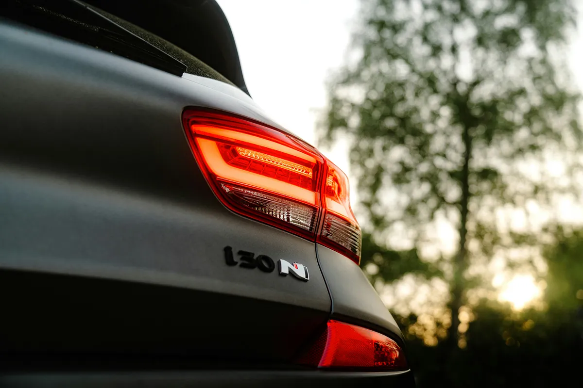 Rear i30 N badge and tail light of a Hyundai hot hatch at dusk, a model banned for NSW and Victorian P-platers