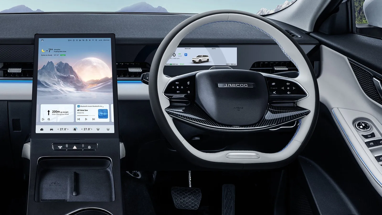 Jaecoo J5 interior showing the portrait central touchscreen, driver display and steering wheel with the JAECOO logo