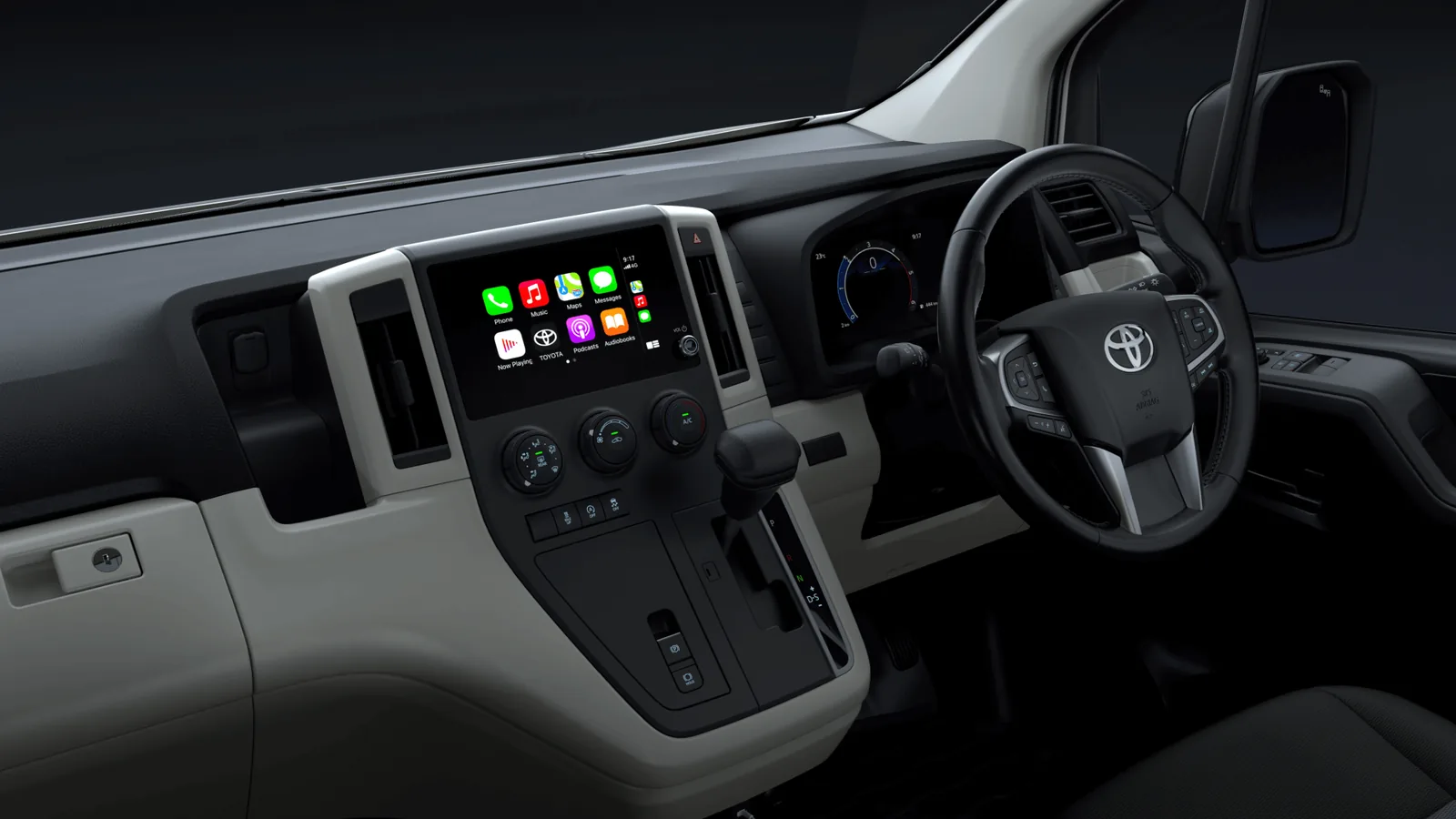 Toyota HiAce dashboard with centre touchscreen running CarPlay and three physical rotary climate dials below
