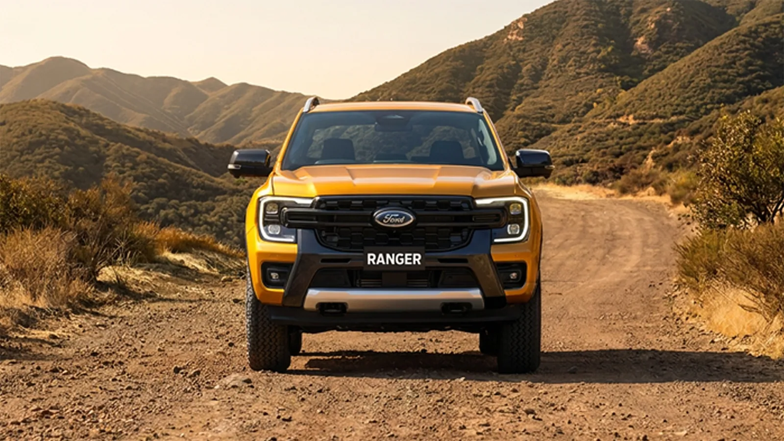 Ford Ranger Wildtrak front-on view on a dirt trail through hilly bushland