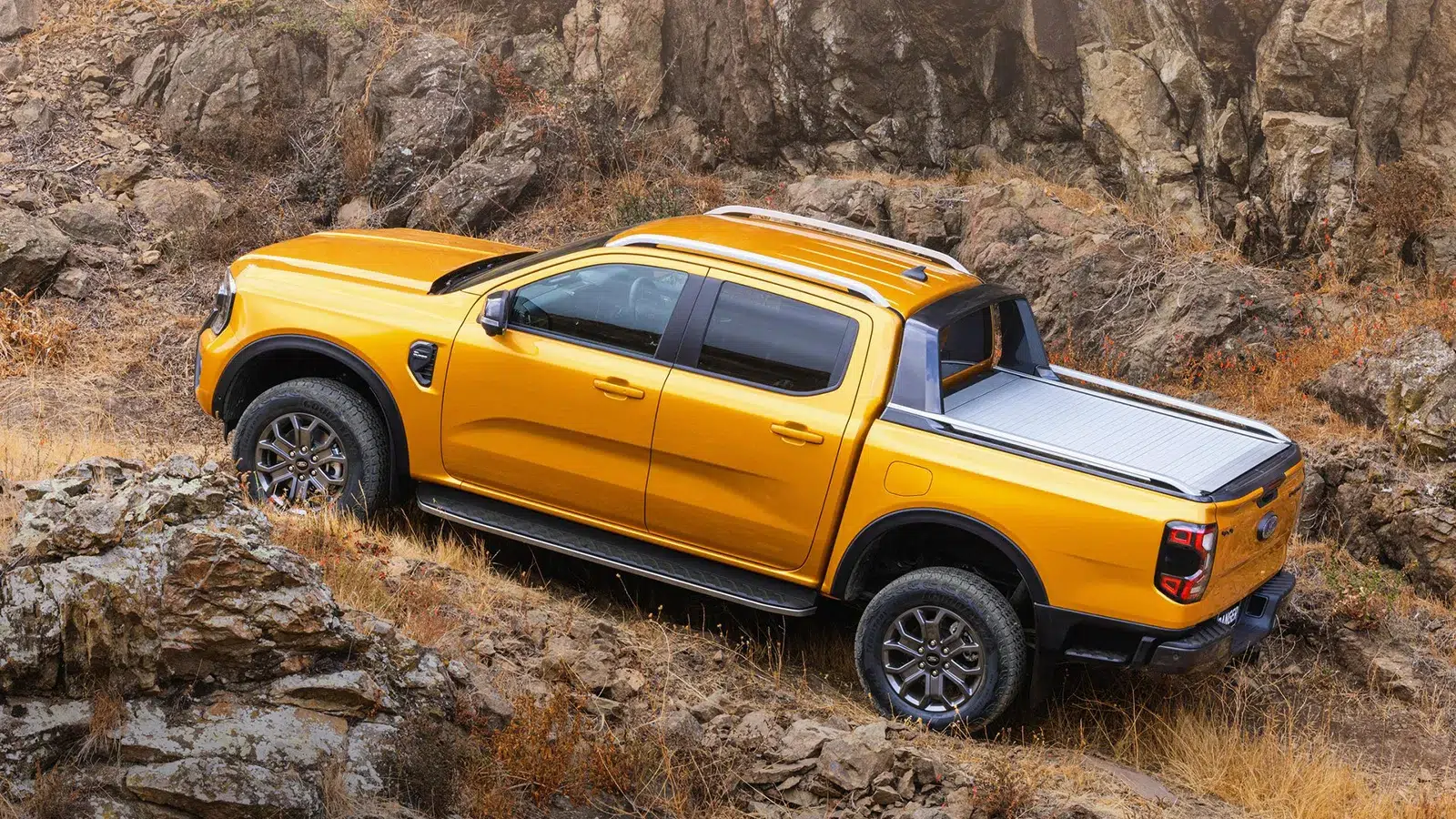 Ford Ranger Wildtrak V6 navigating steep rocky terrain showing off-road ground clearance