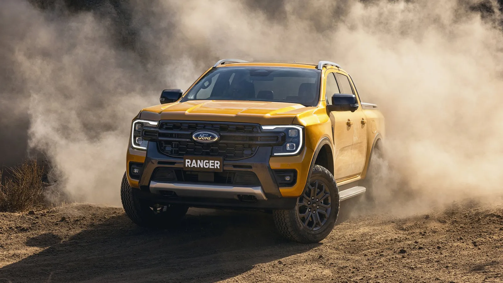Ford Ranger Wildtrak V6 driving through a dust cloud on a dirt track