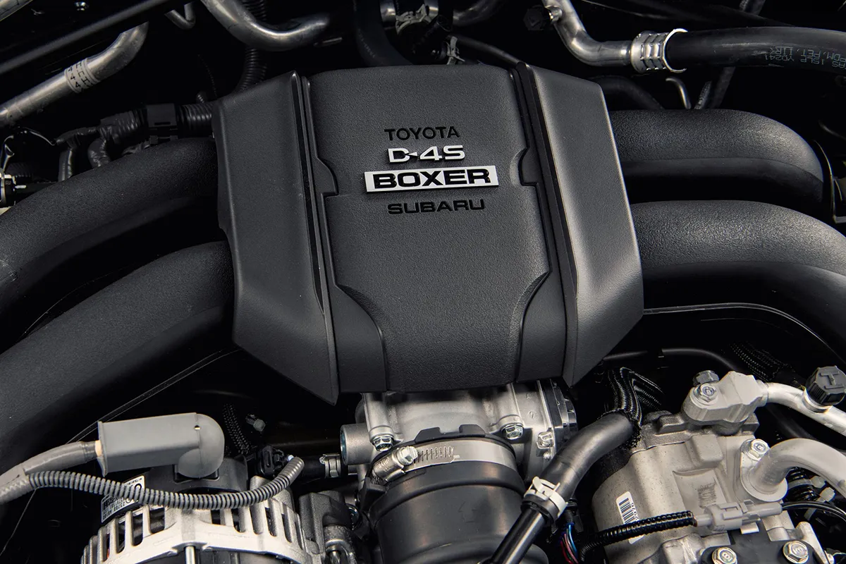 Close-up of the Toyota D-4S Boxer engine cover and intake runners in a GR86 engine bay