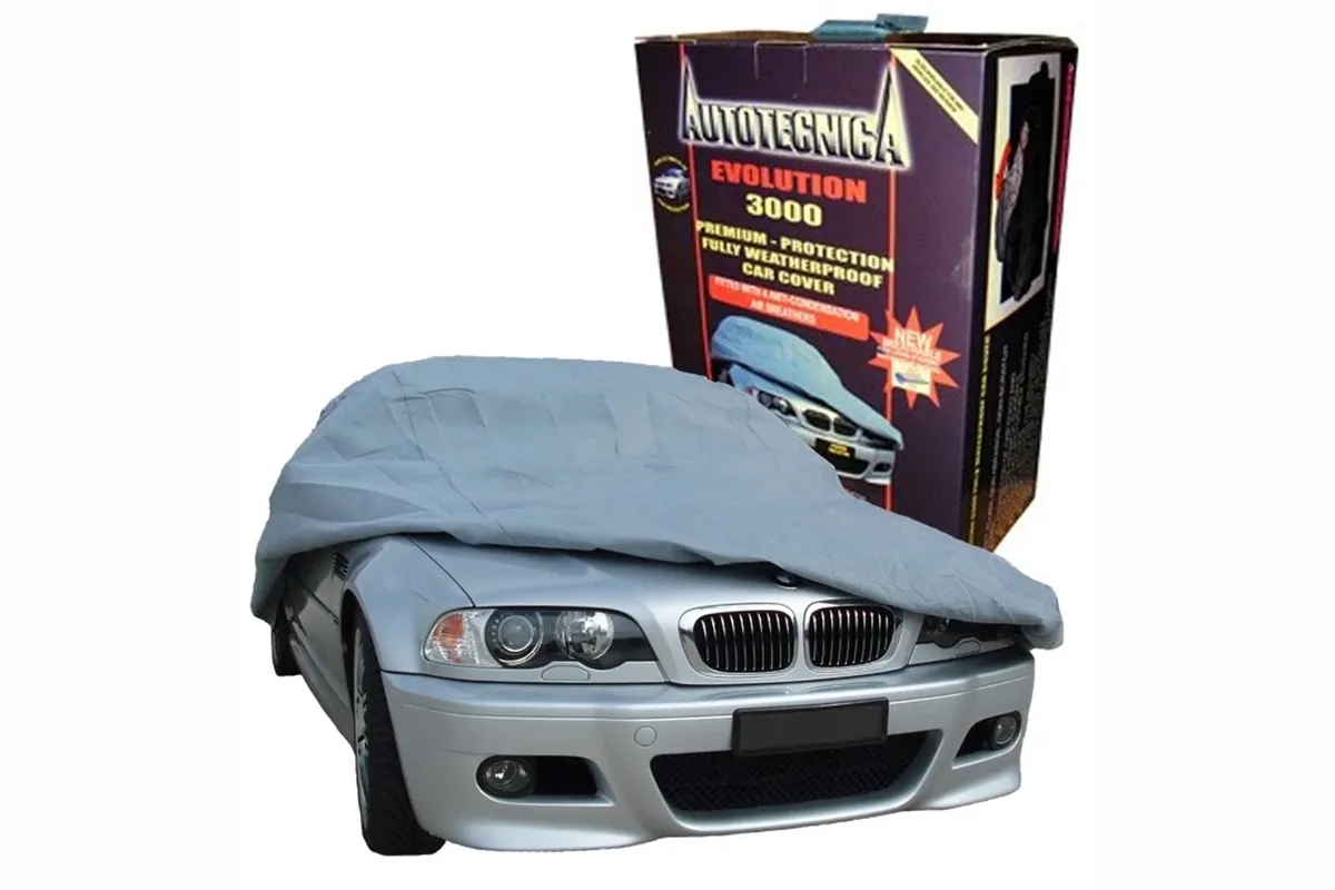 Autotecnica Evolution 3000 car cover partly fitted to a silver BMW sedan beside its retail box