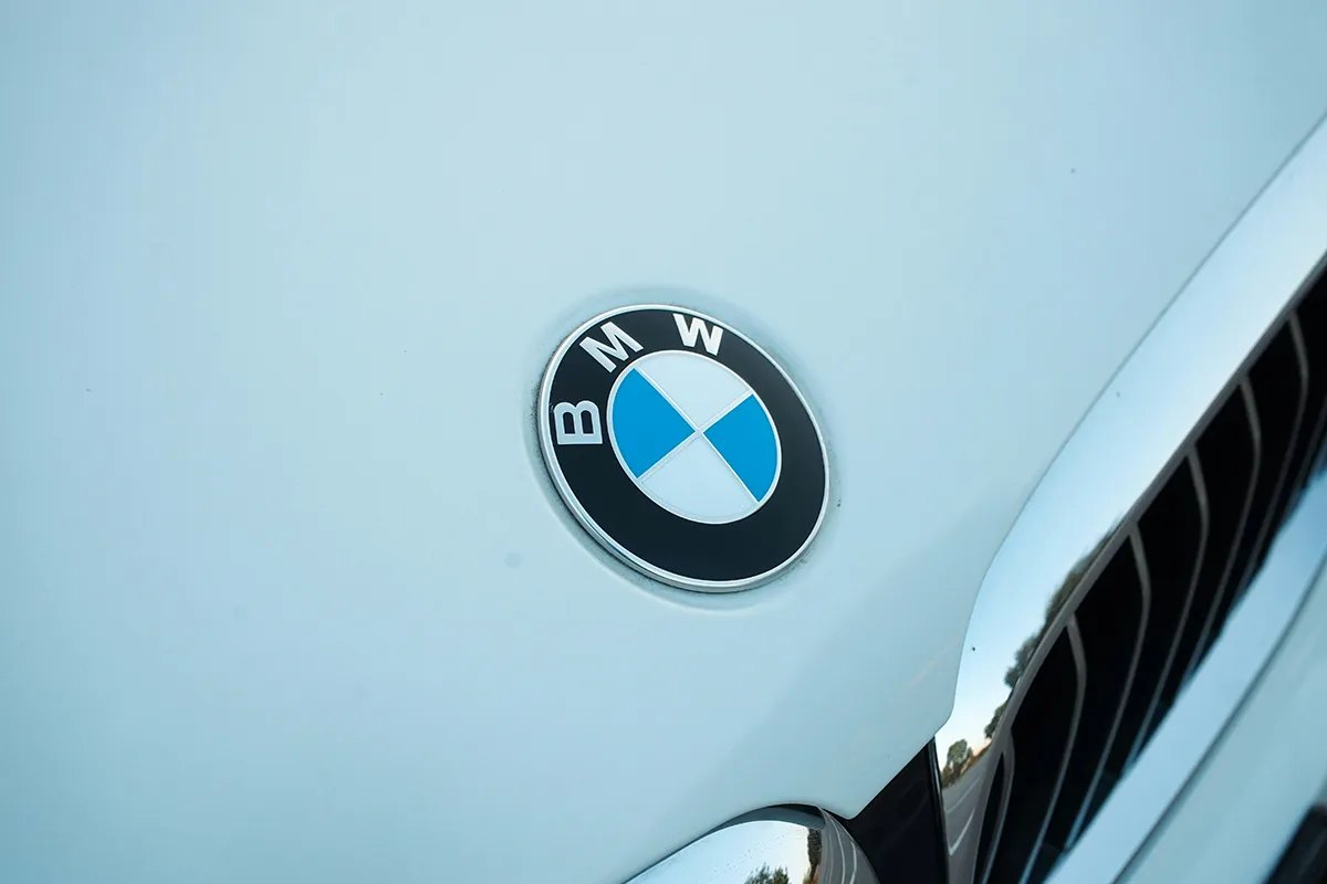 Close-up of a BMW badge and grille on a car's bonnet