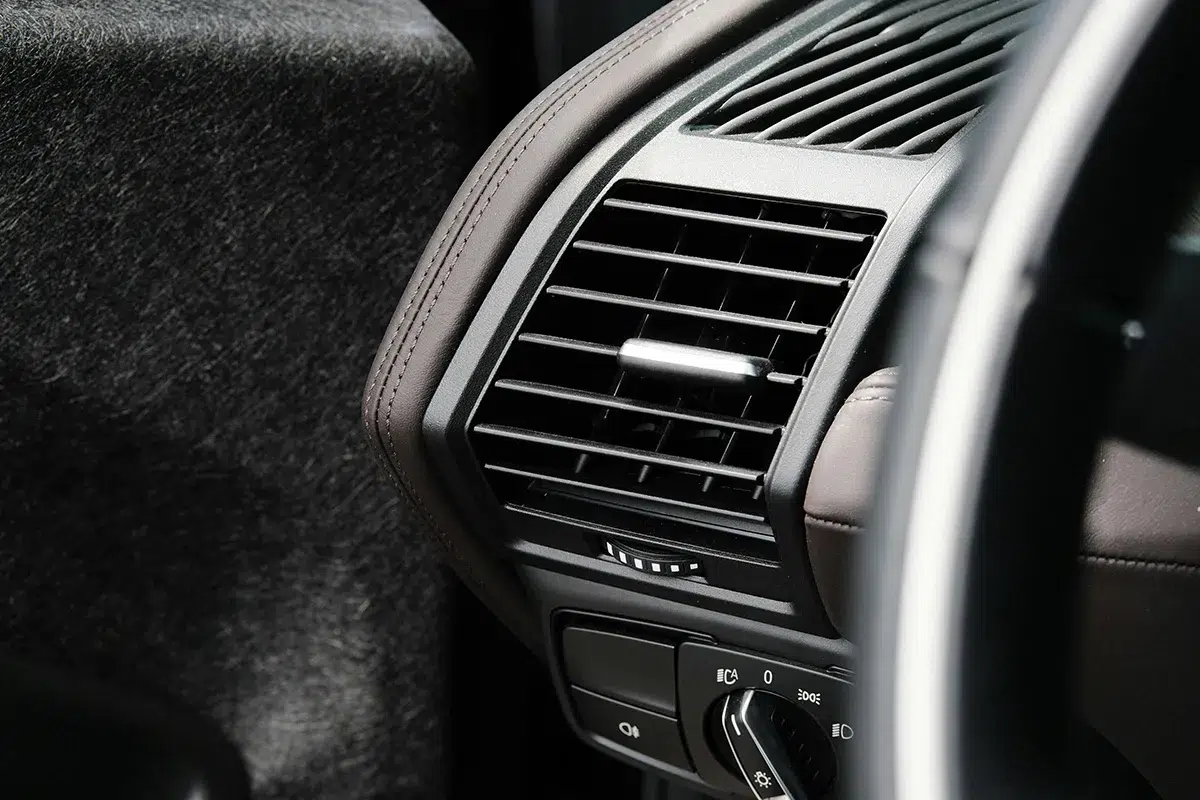 Driver's side air vent on a car dashboard, where weak airflow from a blocked cabin filter shows up first