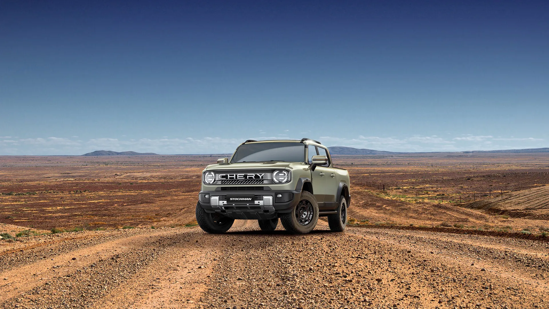 chery-stockman-hero-serpentine-green-aus Chery Stockman diesel plug-in hybrid ute in Serpentine green on a red-dirt outback road, front view
