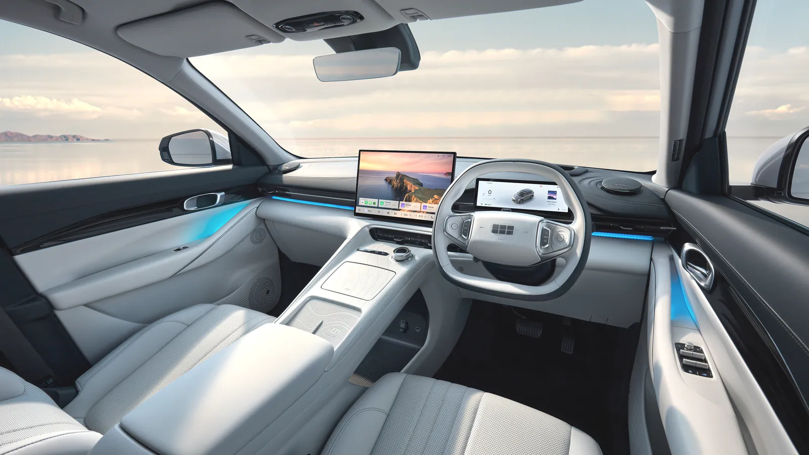 Right-hand-drive Geely EX5 dashboard with 15.4-inch touchscreen and light grey leather-look trim