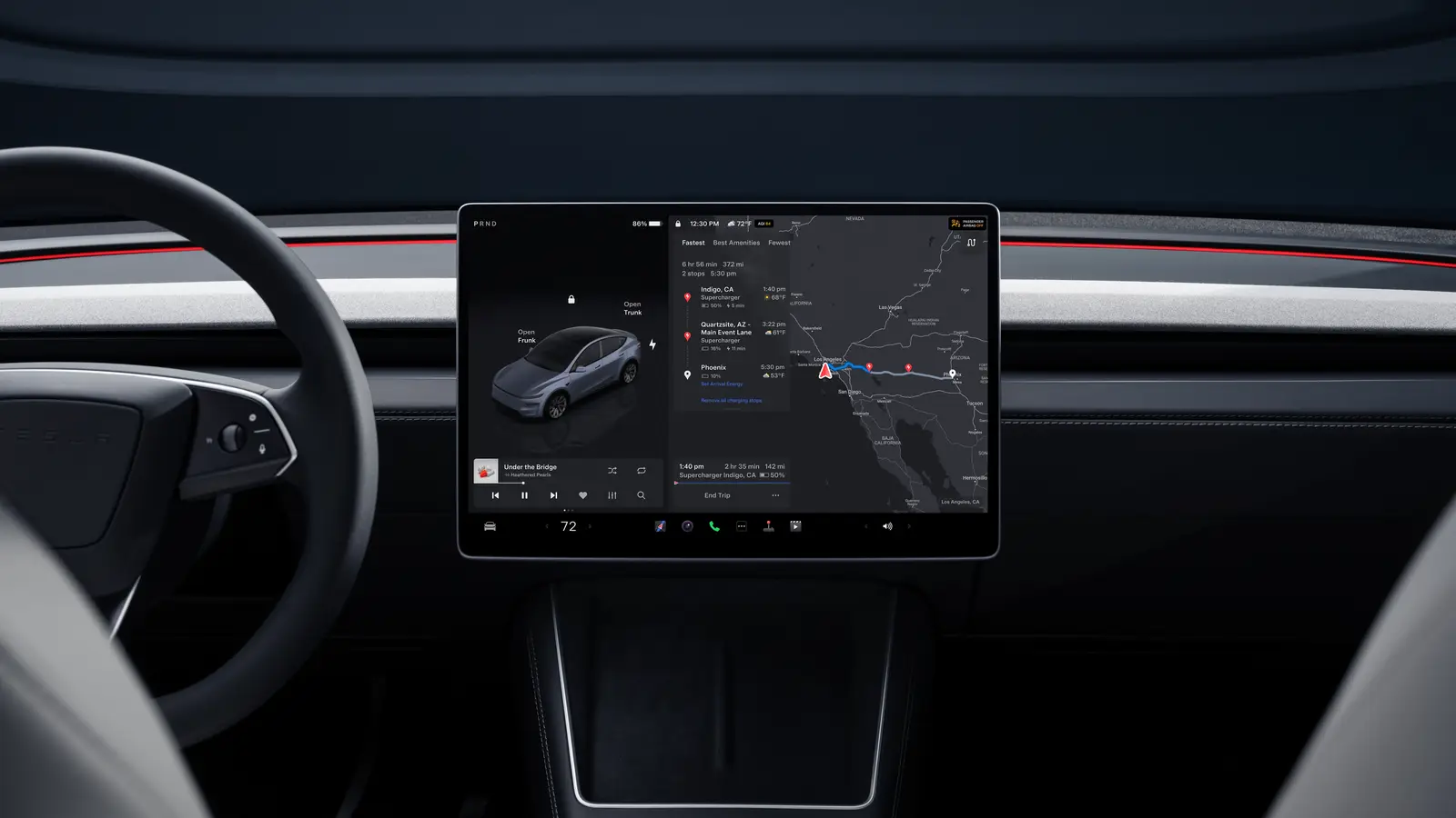 Tesla Model Y dashboard showing the 16-inch centre touchscreen, ambient light strip and steering wheel