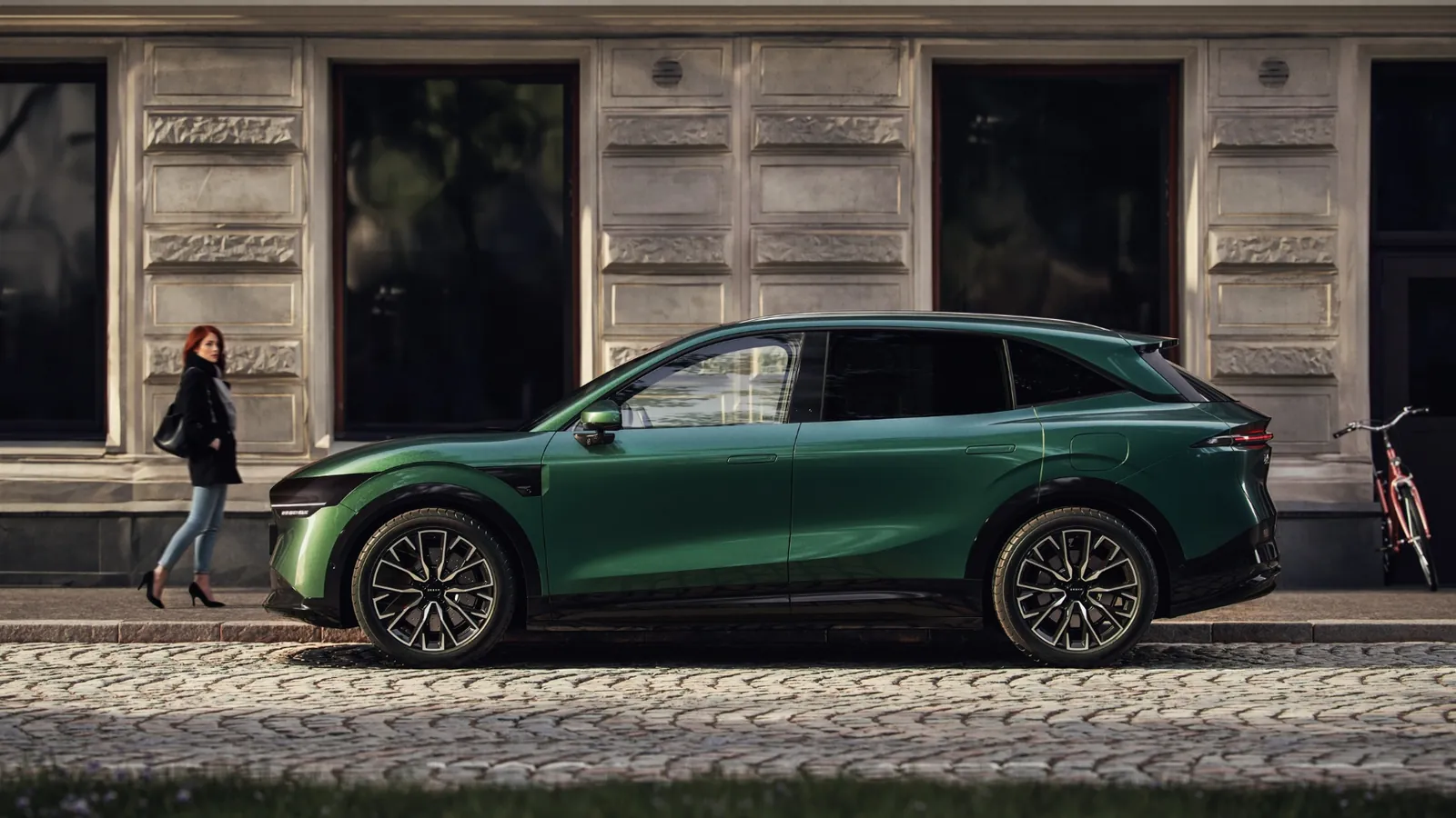 Green Zeekr 7X electric SUV parked on a cobblestone street, full side profile