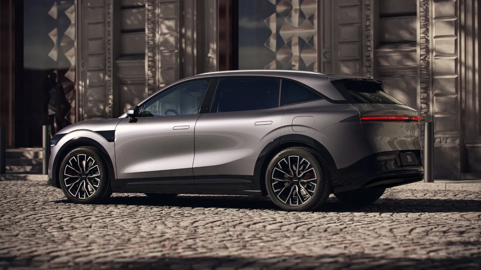 Grey Zeekr 7X electric SUV parked on a city street, rear three-quarter view