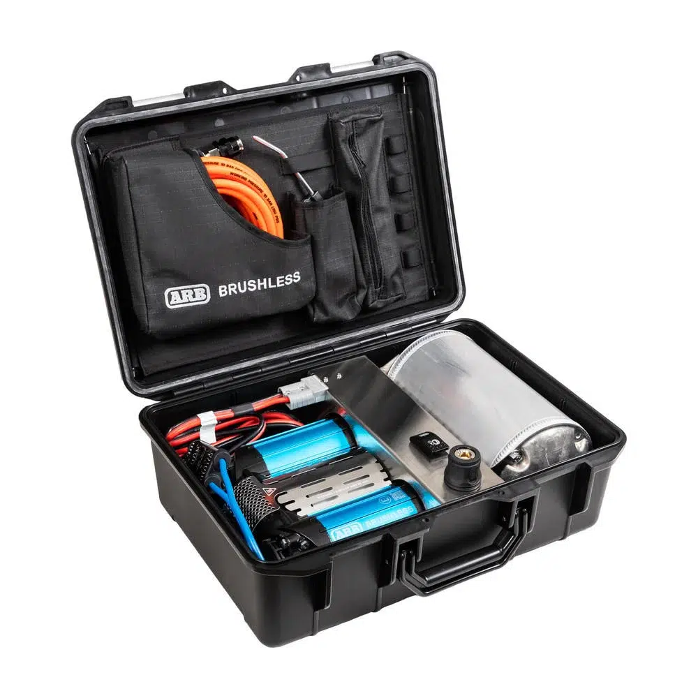 ARB brushless twin portable air compressor in its open case with twin blue motors, air tank and orange hose
