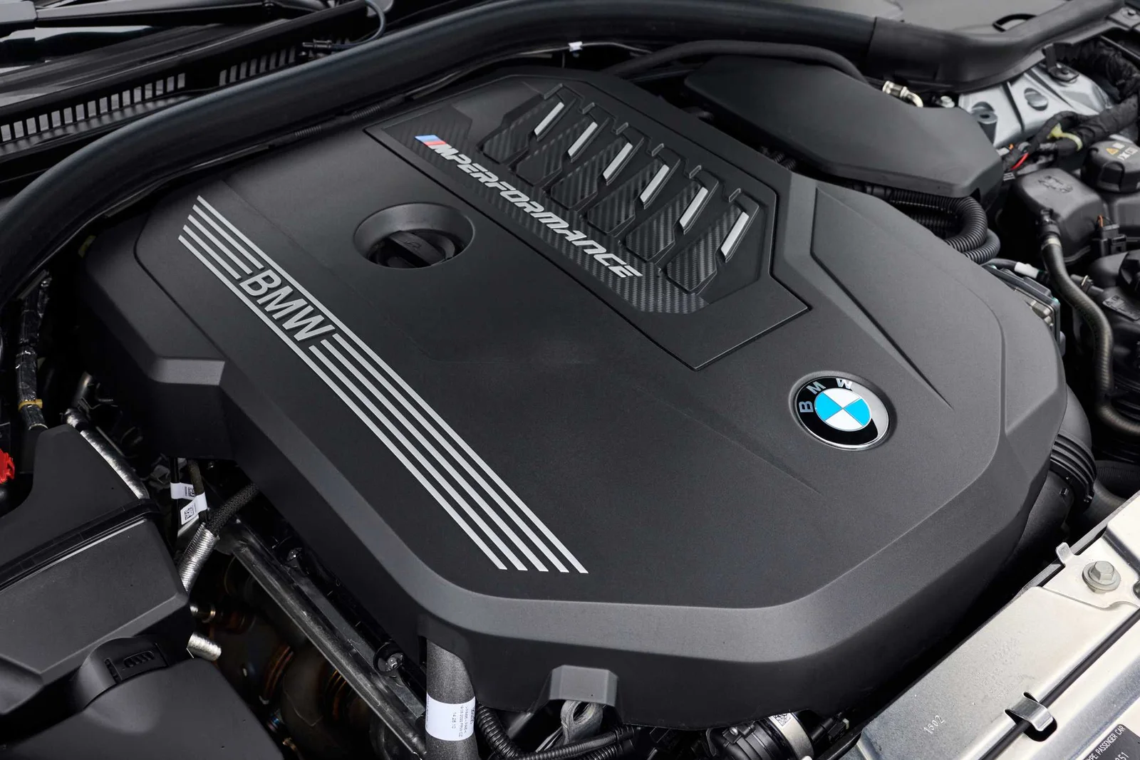 Engine bay of the BMW M340i xDrive showing the B58 3.0-litre turbo straight-six engine cover