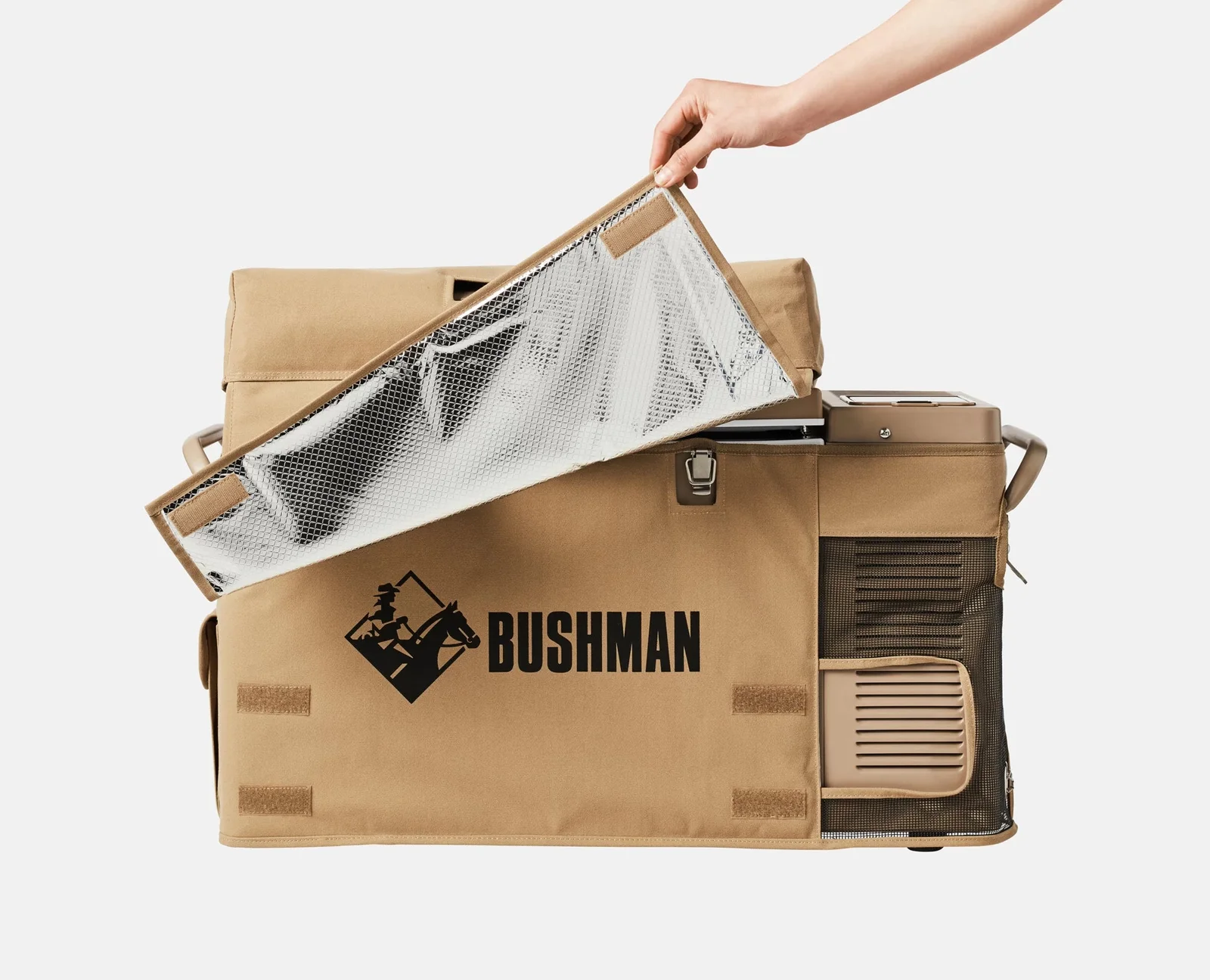 Bushman SC35-52 upright 12V fridge with its insulated canvas cover being lifted to show the reflective lining