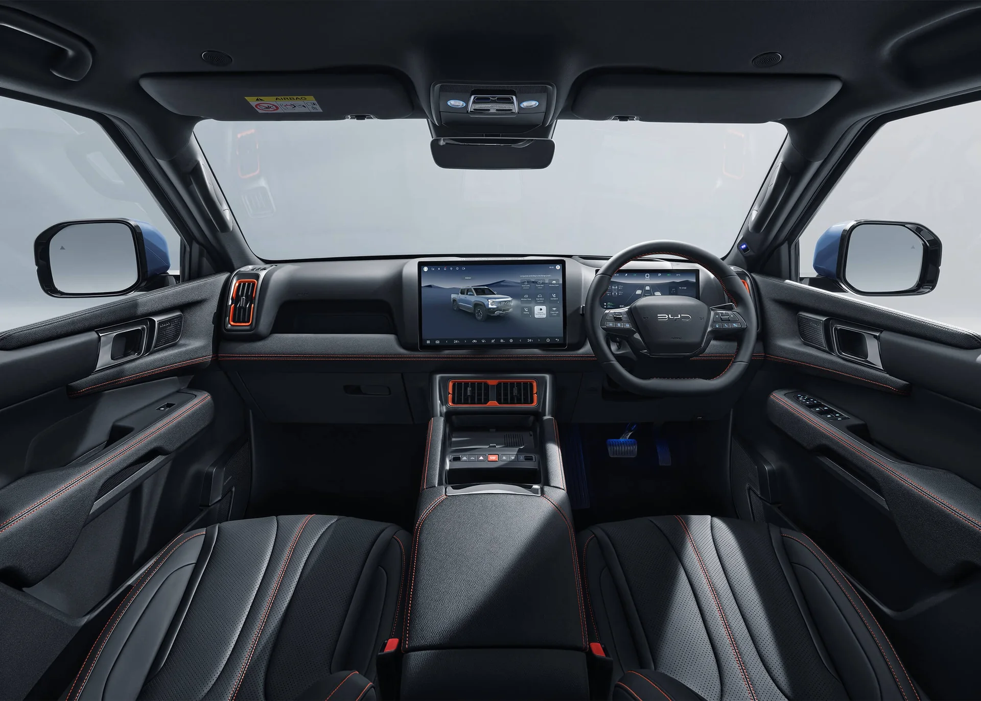 BYD Shark 6 cabin showing the 15.6-inch rotating centre screen, digital cluster, console and leather front seats