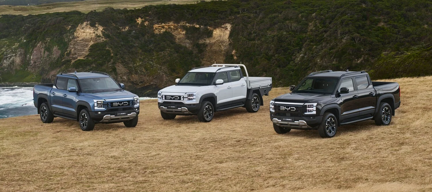 BYD Shark 6 Premium, Dynamic Cab Chassis with alloy tray and Performance utes parked on a coastal clifftop paddock
