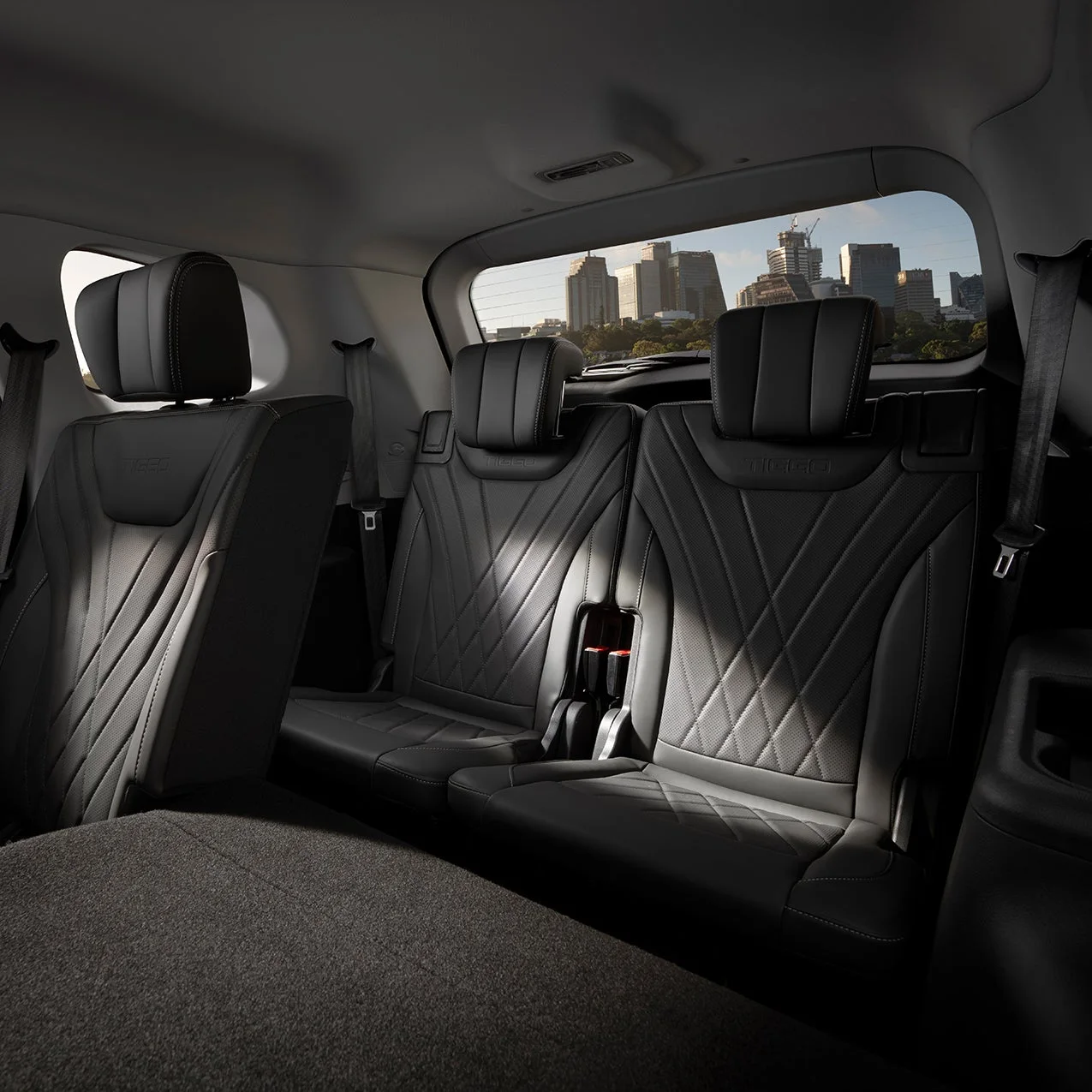 Chery Tiggo 8 Pro Max cabin showing the black second-row bench and folding third-row seats