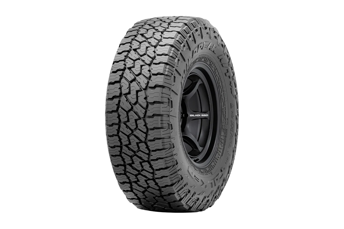 Falken Wildpeak A/T4W all-terrain tyre on a black wheel showing the tread blocks and shoulder lugs