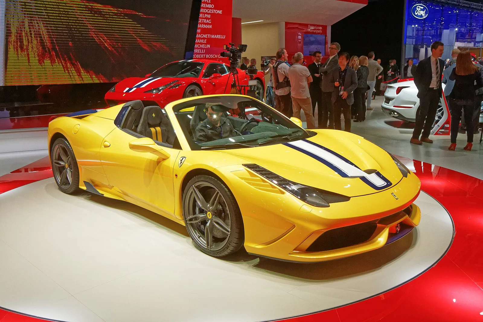 Yellow Ferrari 458 Speciale A spider on display at its 2014 Paris Motor Show debut, front three-quarter view