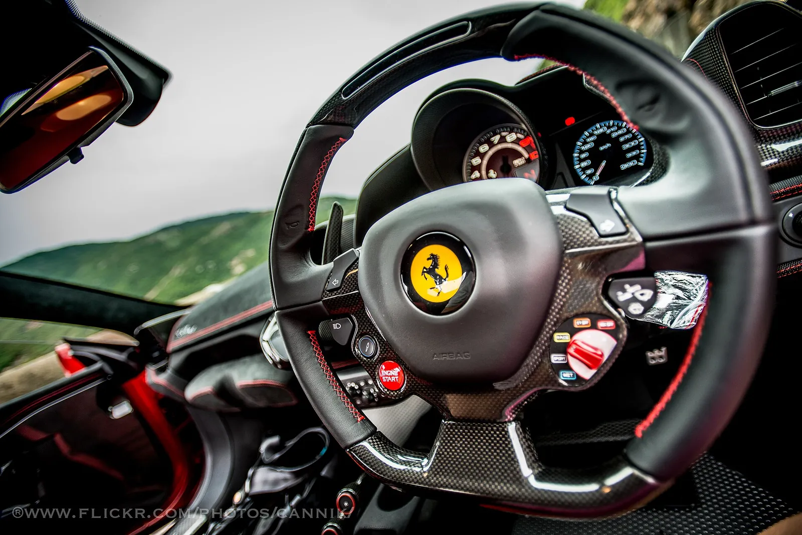 Steering wheel with manettino switch and carbon-fibre trim inside a Ferrari 458 Speciale
