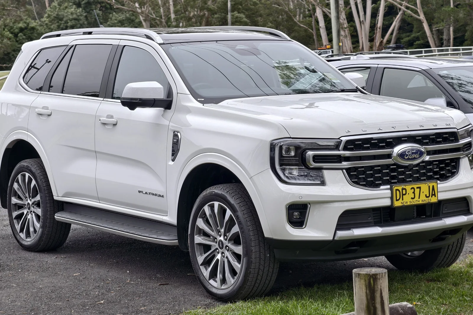 White Ford Everest Platinum V6 diesel seven-seat SUV parked at a bush car park in New South Wales