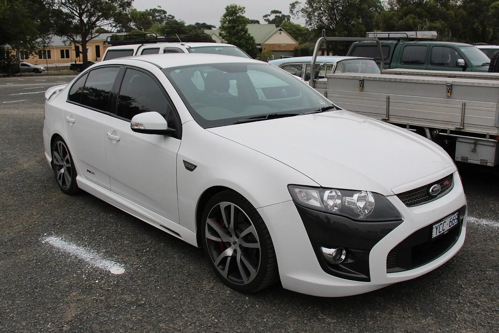 White 2011 FPV F6 sedan based on the FG Falcon, front three-quarter view in a car park