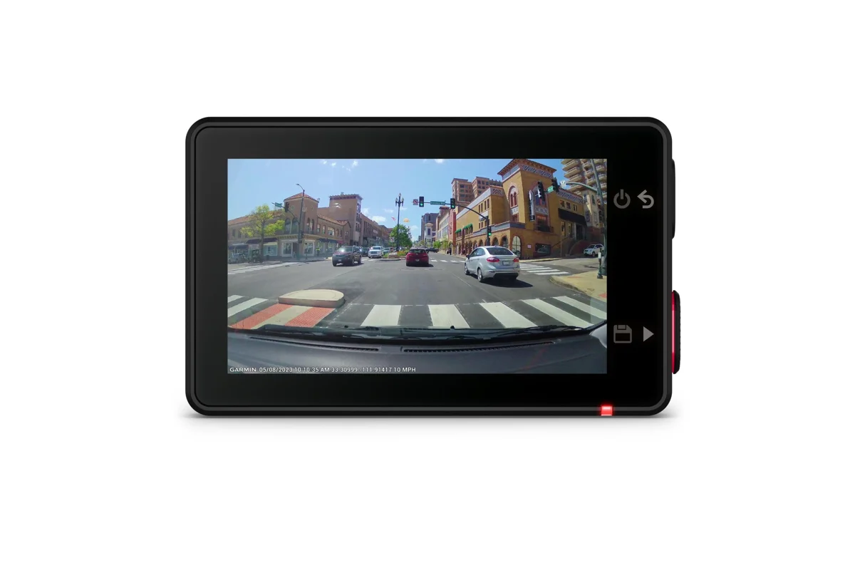 Garmin Dash Cam X310 with its touchscreen showing recorded footage of a city intersection