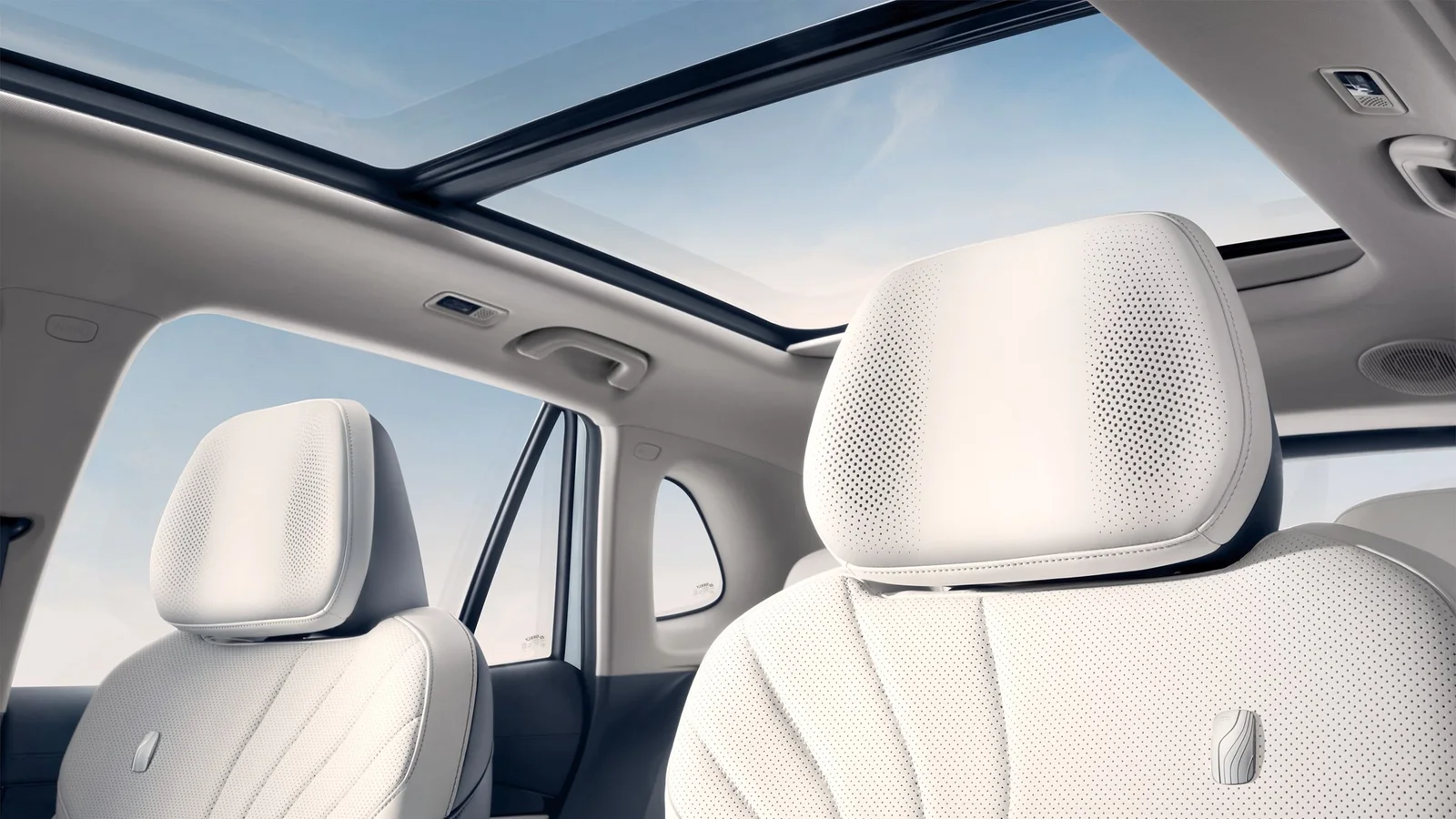 Geely EX5 electric SUV cabin with white rear seats under the panoramic glass roof