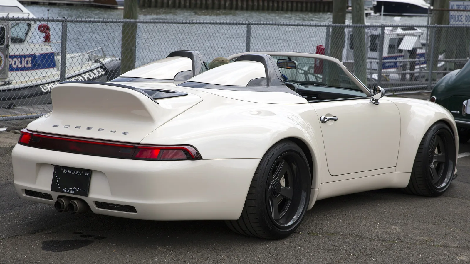 Rear three-quarter of a white Gunther Werks 993 Speedster with ducktail spoiler at the 2025 Greenwich Concours