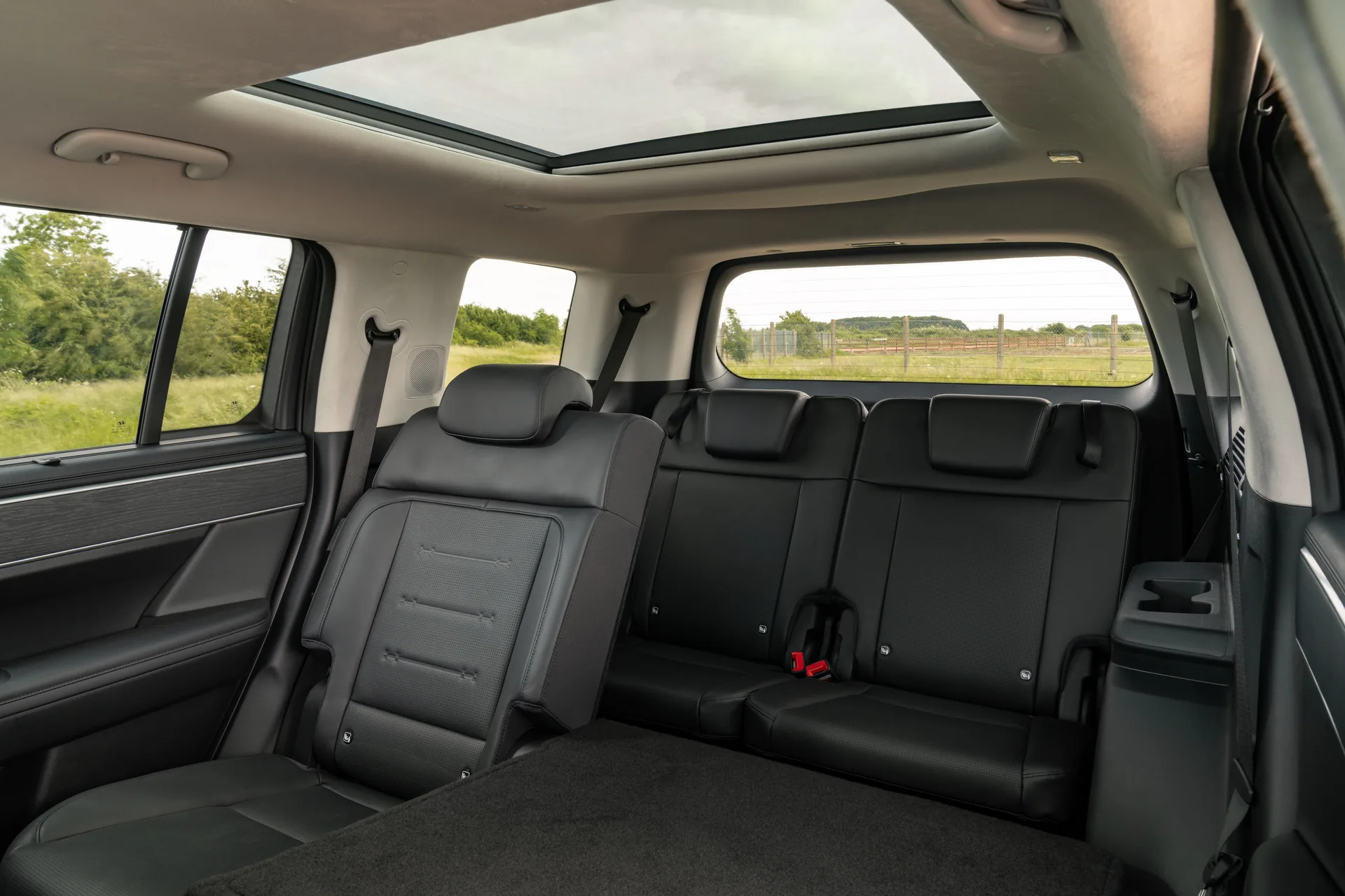 Third-row seats in the Hyundai Santa Fe seen from the side door, with the second row folded forward