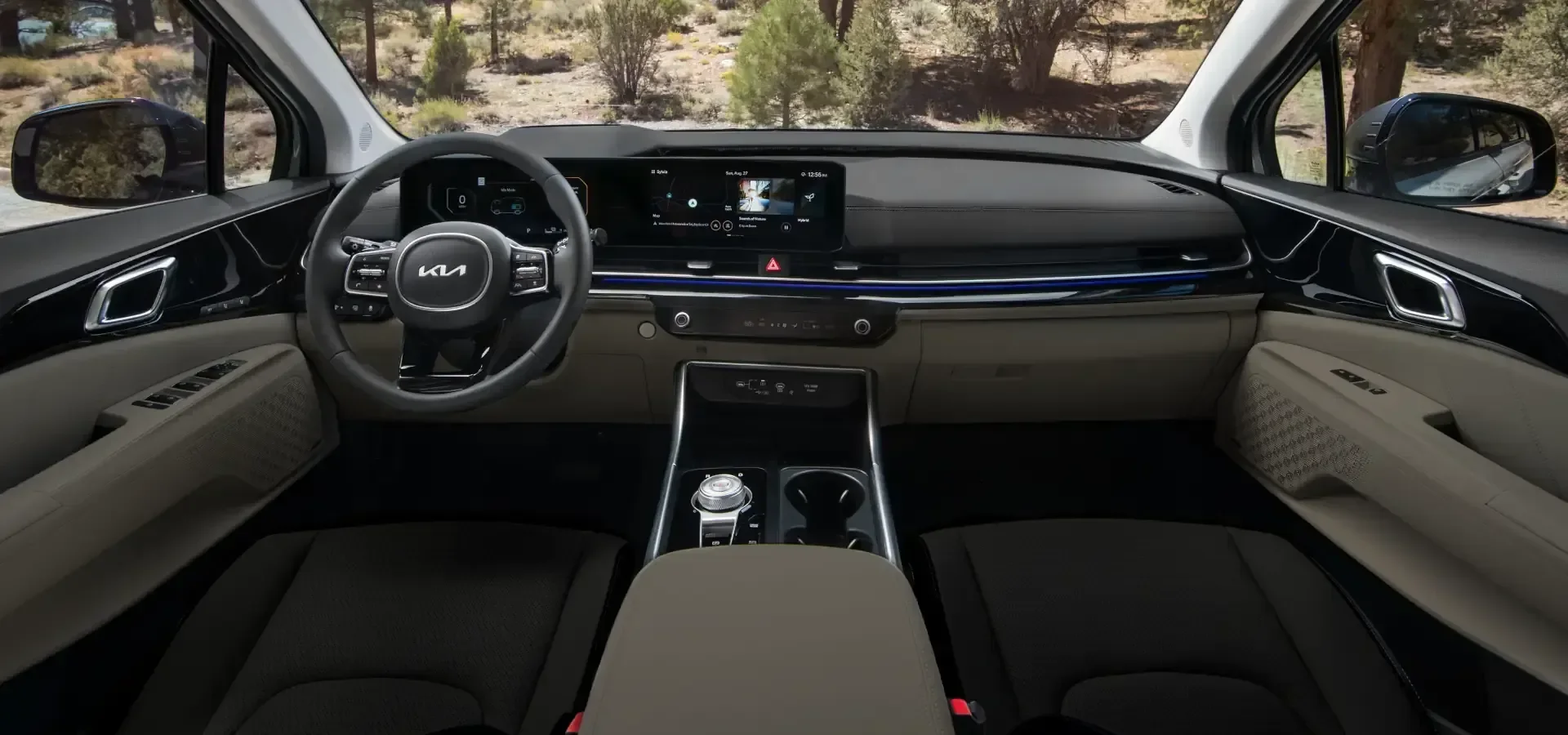2026 Kia Carnival right-hand-drive dashboard with twin curved screens and beige front seats
