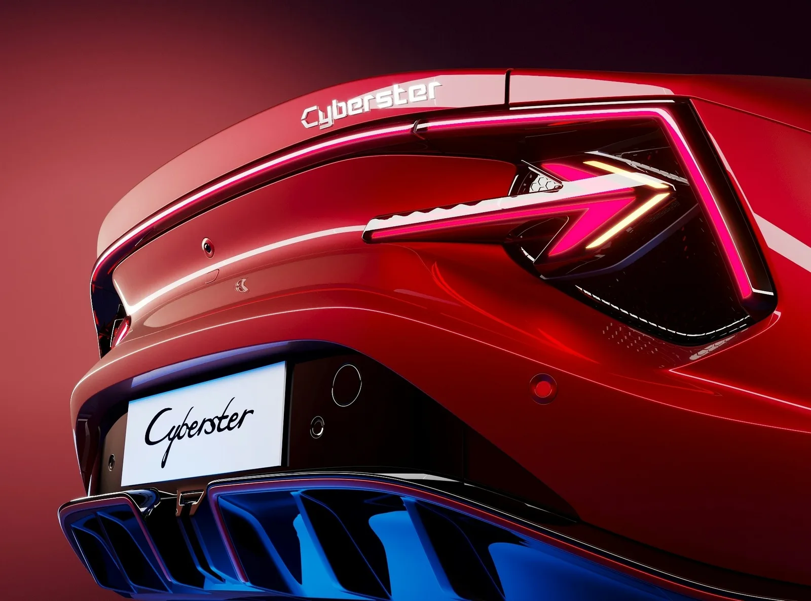 Close-up of the MG Cyberster arrow-shaped LED tail-light and rear deck badge in red paint