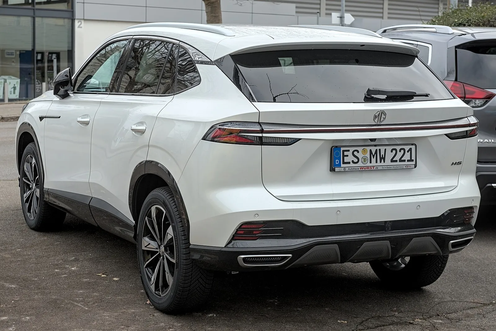 Rear three-quarter view of a white second-generation MG HS, the body shared with the Australian HS Hybrid+