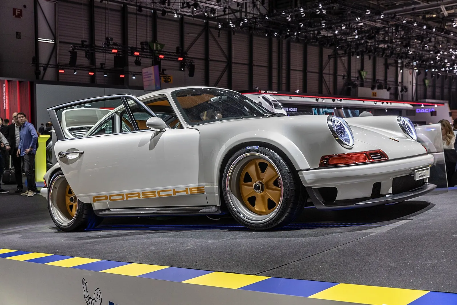 White Singer DLS with gold BBS magnesium wheels and Porsche side script on display at the 2019 Geneva motor show