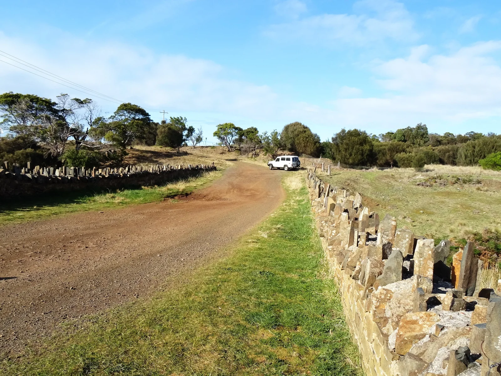 Convict-built Spiky Bridge near Swansea, Tasmania, with its upright stone parapet beside the old road alignment