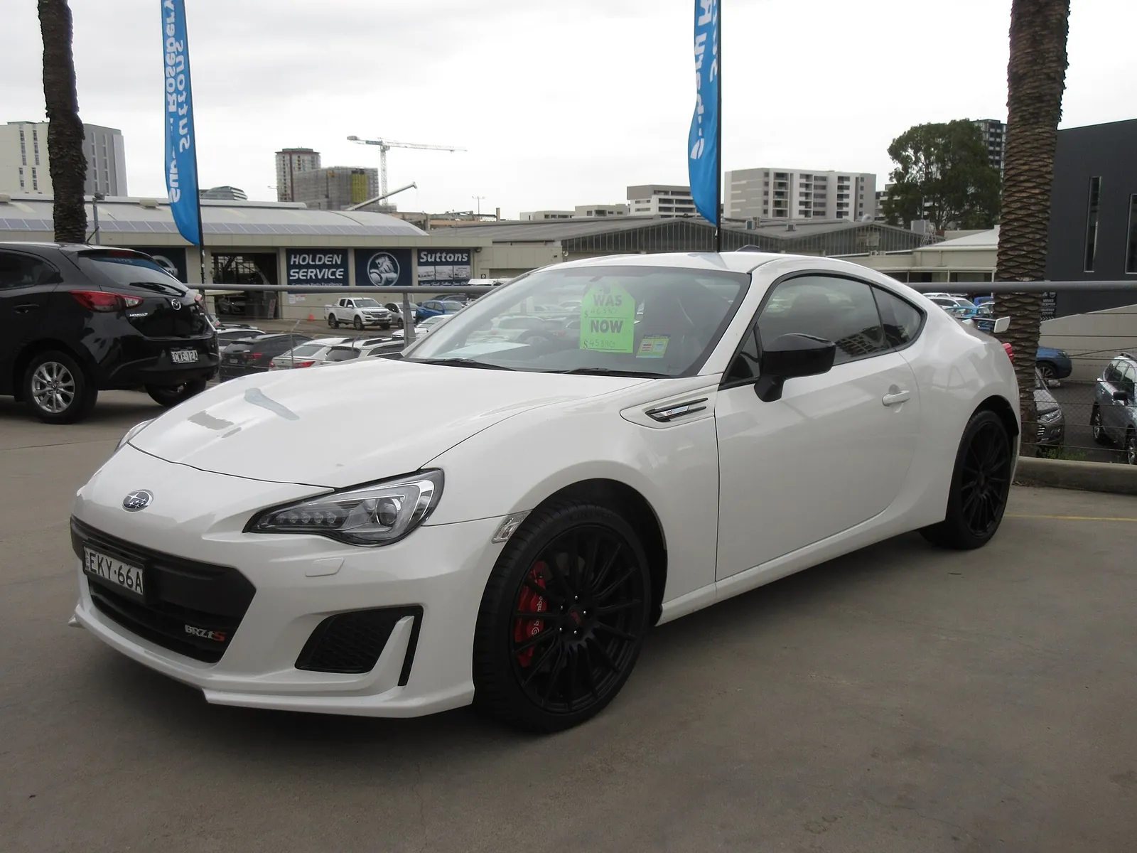 White facelifted Subaru BRZ tS with black STI wheels and red Brembo brake calipers on a Sydney dealership lot